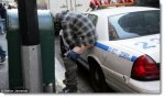 occupy-wall-street-man-pooping-on-police-car-oct-2011.jpg