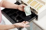 5893284-Cashier-with-nearly-empty-cash-register-Metaphor-for-recession--Stock-Photo.jpg
