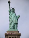 3D80B3A500000578-4247616-A_banner_reading_Refugees_Welcome_hung_on_the_Statue_of_Liberty_-m-3_14.jpg