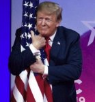 trump hugs flag.jpg