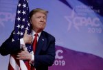 Donald-Trump-hugs-flag-CPAC-2019-900.jpg