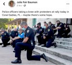 police taking a knee.jpg