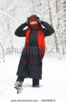 stock-photo-woman-s-face-covered-with-scarf-winter-outdoor-portrait-326389613.jpg